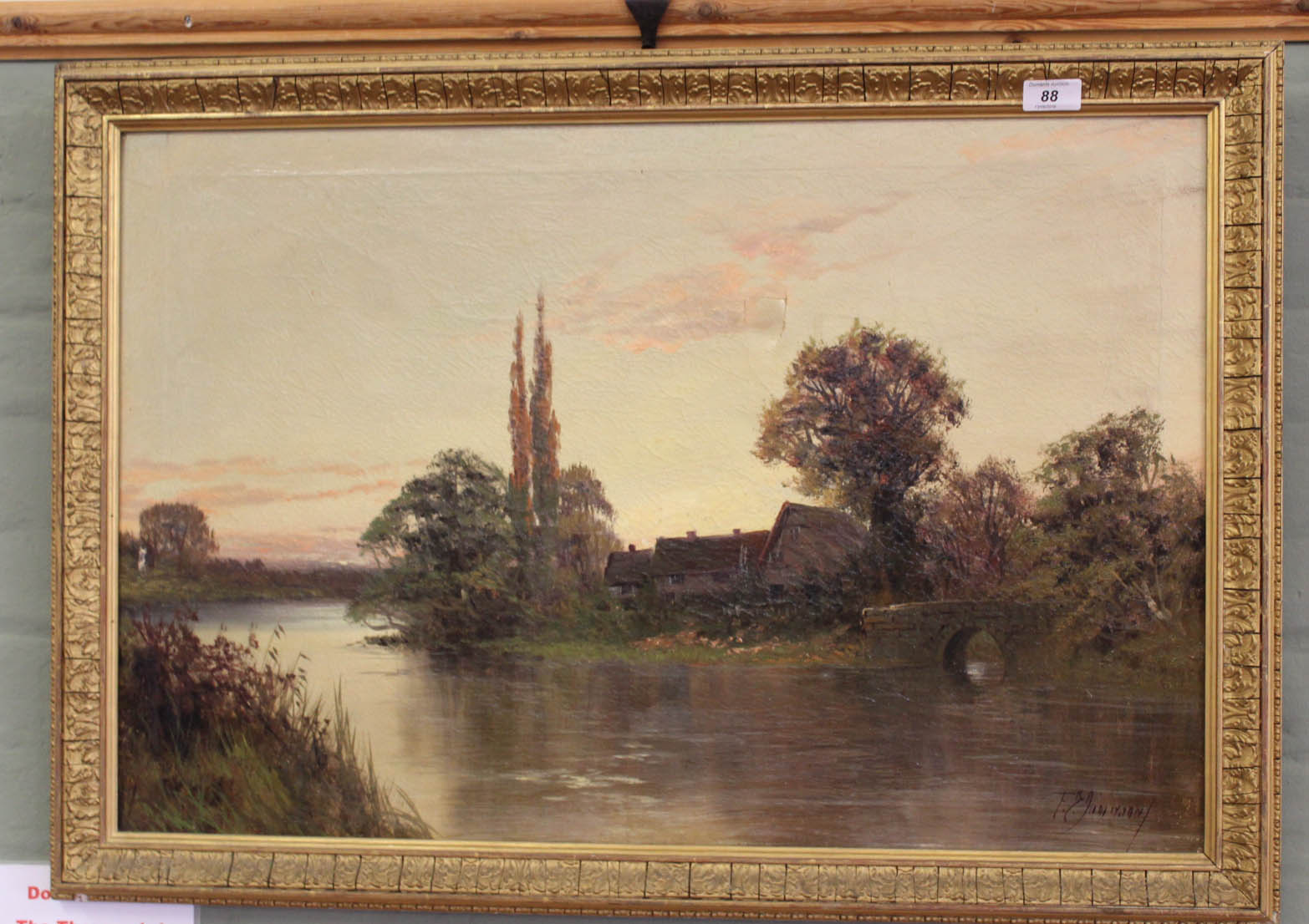 A signed oil on canvas of a river scene with farmhouse and bridge,