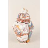 A 19th Century Imari bulbous lidded jar with figure and relief dragon decoration, base signed,