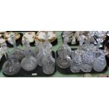 Sixteen various cut glass decanters (two trays)
