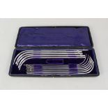 A cased set of surgical catheters by Down Bross