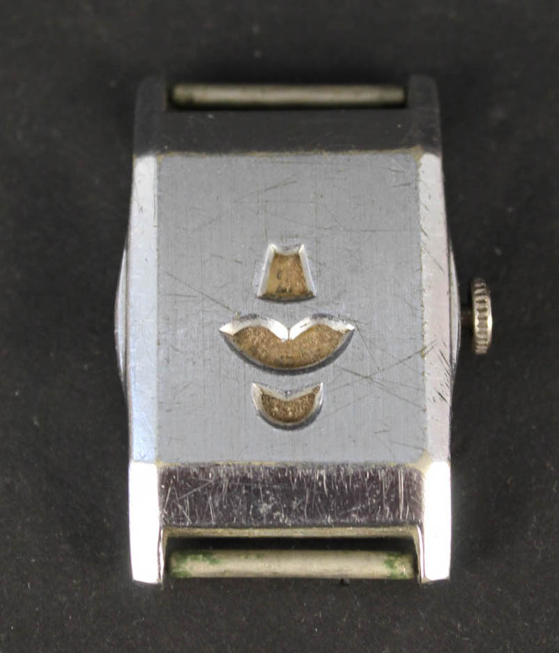 An unusual nickel chrome cased jump hour watch (no strap)