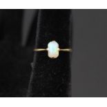 An 18ct gold opal set ring,