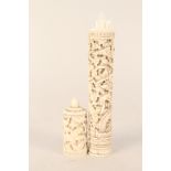 A vintage Cantonese carved ivory cylindrical container and contents