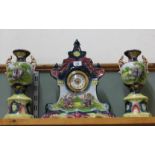 A Victorian pottery clock garniture