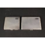 Two silver cigarette cases with engine turned decoration,