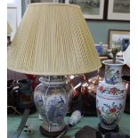A gilt metal and onyx Corinthian column table lamp and two oriental porcelain plus one metal poppy