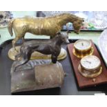 A brass horse, shell case scoop, clock,