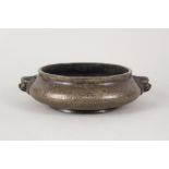 A Chinese squat shaped bronze censer with temple lion boss handles, 6 character mark,