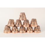Ten miniature copper jelly moulds,