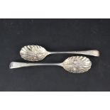 A pair of silver berry spoons, makers mark T.C.