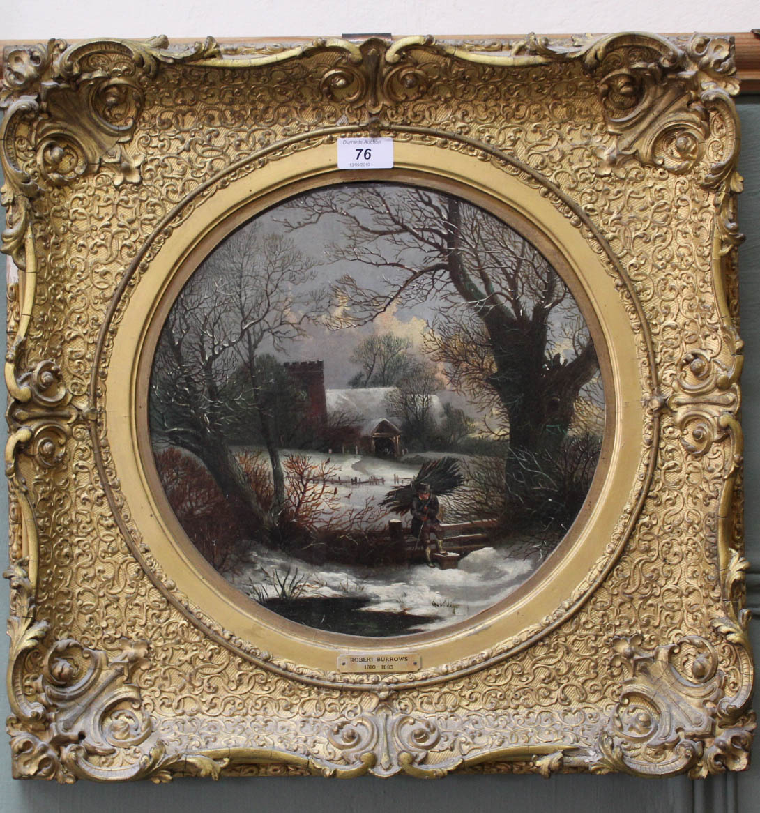 A 19th Century oil on panel of a winter scene with woodcutter and cottage,