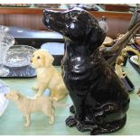 A large pottery black glazed dog plus two others