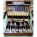 An oak canteen of silver plated cutlery