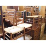 A set of six Italian made teak dining chairs with rush seats