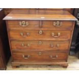 A George III mahogany chest of two short and three long drawers of small proportions with oak lined