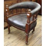 A Victorian mahogany frame and leather upholstered smokers bow chair