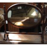 A 19th Century oval dressing table swing mirror