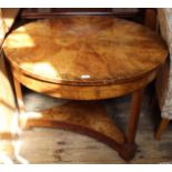 A 19th Century quilted ash round table with single drawer on three legs and under tier