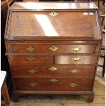 An 18th Century oak country made five drawer bureau with original handles