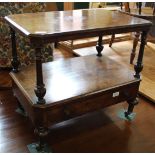 An early Victorian burr walnut whatnot base with single drawer on brass and porcelain castors