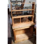 A modern pine hanging shelf and a modern pine bookcase with adjustable shelves