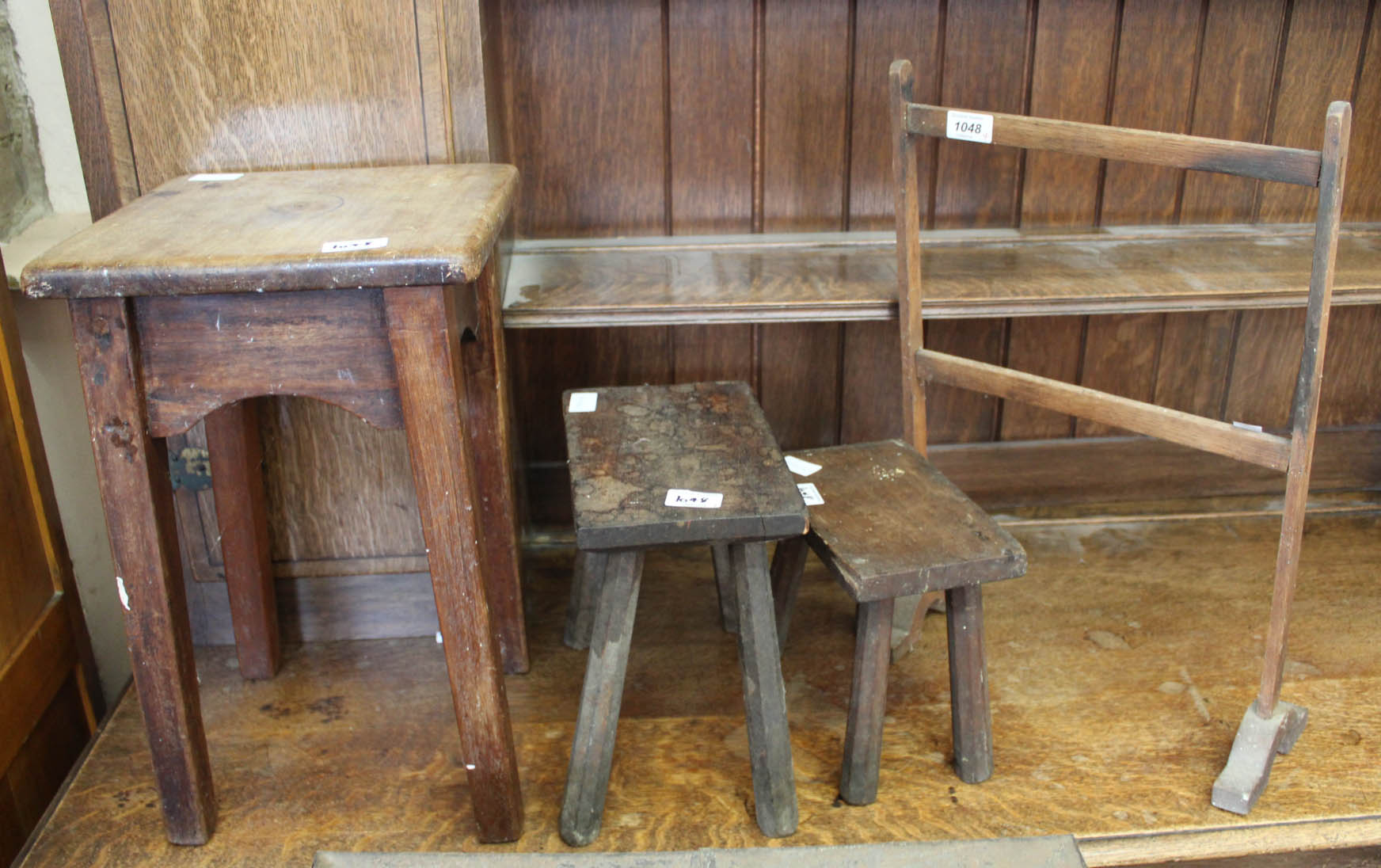 Two oak milking stools,