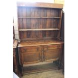A 1920's oak barley twist dresser with shelved back