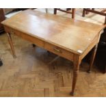 A late Victorian oak sloped writing desk with two drawers