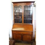 An Edwardian inlaid mahogany bureau bookcase with astragal glazed doors and cross banding veneer