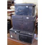 Four assorted metal storage trunks,