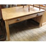 A Victorian pine farmhouse table with oversized drawer to the side and cast handles