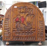 A heavy Arts and Crafts oak fire screen carved with a galleon on choppy waters