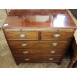 A George III mahogany chest of two short and two drawers with slide