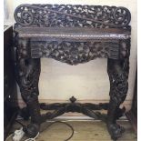 An unusual carved oak hall table with Green man style carved decoration
