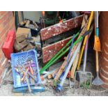A selection of wood working and gardening tools and a workmate