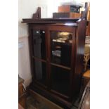 A Victorian stained pine hanging glazed cupboard