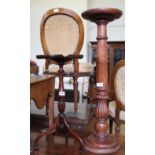 A mahogany wine table and turned mahogany torchere