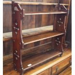 A set of pierced mahogany hanging shelves