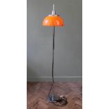An Italian Harvey Guzzini style chrome standard lamp with orange shade