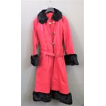 A fur trimmed red leather coat and a pair of flared Levi jeans (size 30" waist) and another pair of