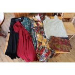 A collection of vintage clothing including dresses