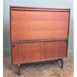 A late 1960's teak desk with drop down front,