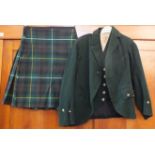 A bespoke hunting jacket with tartan kilt and monogrammed buttons