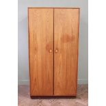 An Ercol double wardrobe