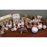 A large collection of ornaments including a Wedgwood Mrs Tiggywinkle tea set and other Beatrix