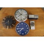 Two Metamec clocks (one white and one blue), a Smith wall clock,