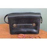 A vintage black leather Hermes handbag