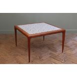 A Danish tiled top teak coffee table on tapered legs by Silkeborg