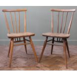 Two blonder Ercol stick back chairs