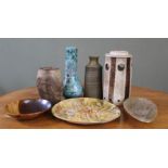 A selection of studio pottery pieces including vases and a fish decorated plate